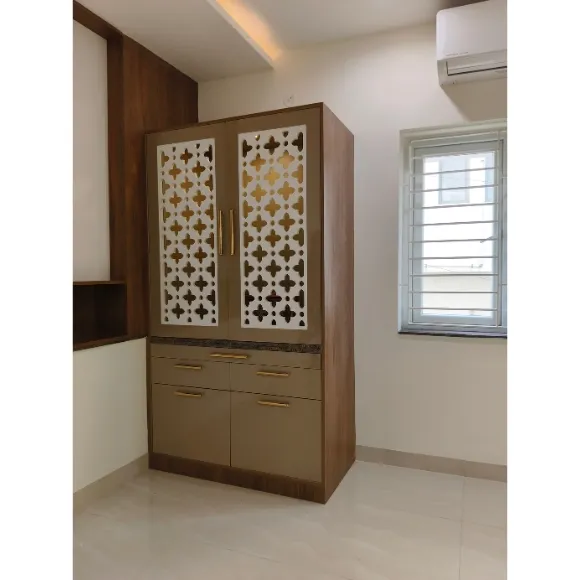 Modern pooja unit with elegant wooden finish and decorative panels