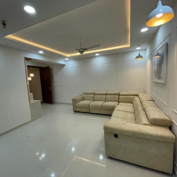 Modern living room interior with elegant furniture, TV unit, and ambient lighting