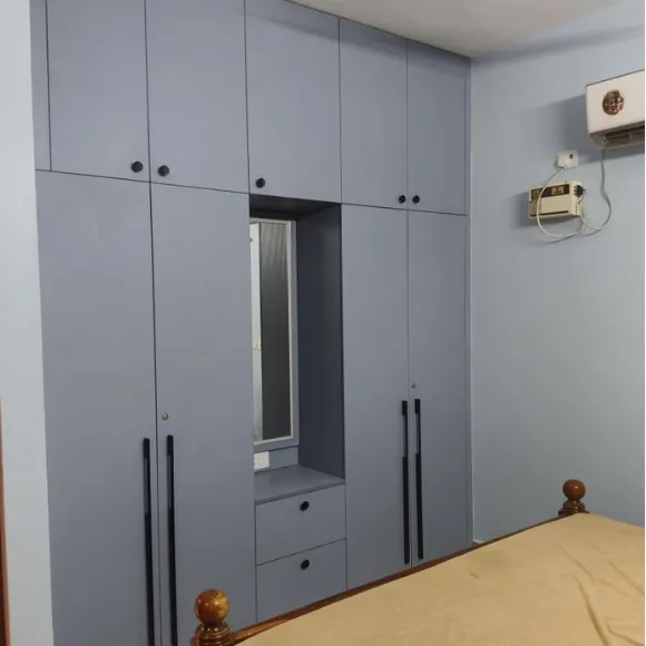 Modern wardrobe with custom shelves, drawers, and hanging storage